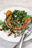 wedge baked of pumpkin with arugula and cheese