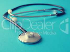 Stethoscope on a blue background, cross toning