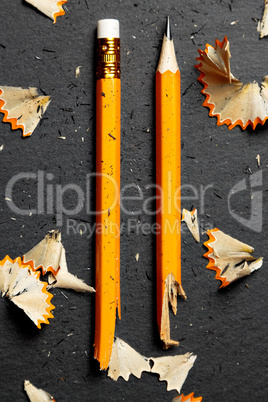 Broken pencil with shavings.