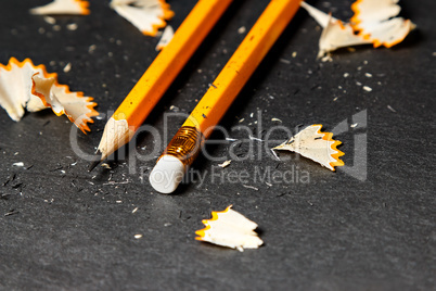 Two pencils with shavings.