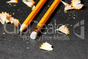 Two pencils with shavings.