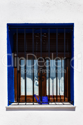 Blue window with bars.