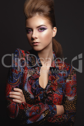 Portrait of beautiful young girl with glamorous evening makeup