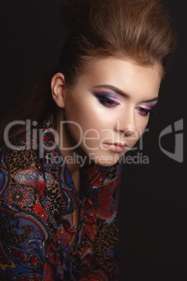 Portrait of beautiful young girl with glamorous evening makeup