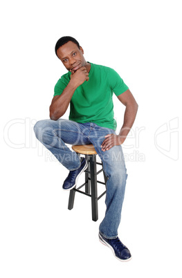 African man sitting on chair and thinking