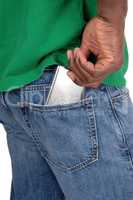 Black man putting cell phone in back pocket
