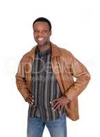 Smiling African man standing in leather jacket