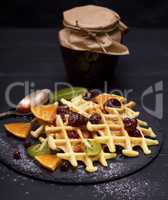 baked Belgian waffles with jam and fresh fruits