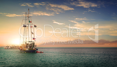 Sailboat at sunny sunset