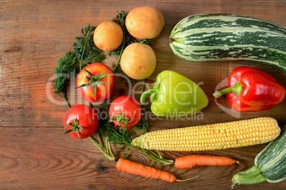 Vegetables laid out on a wooden table. Flat lay,top view. Free s