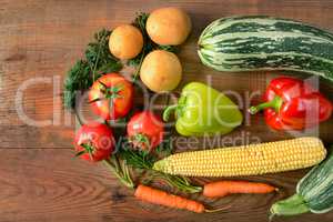 Vegetables laid out on a wooden table. Flat lay,top view. Free s