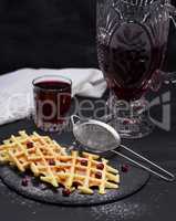 baked waffles and compote in a glass