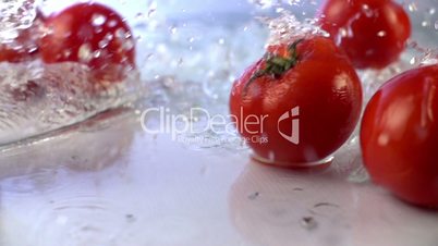 Tomatoes Falling in Slow Motion in water.Shot in 200 fps
