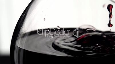 Red wine pouring, slow motion