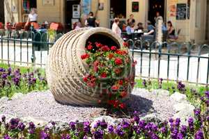 The street decoration and tourists are in cafes in Kerkyra, Gree