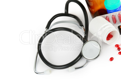 Stethoscope, pills and medical preparations isolated on white ba