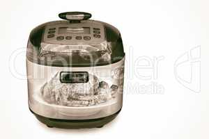The slow cooker on a white background. The double exposure effec