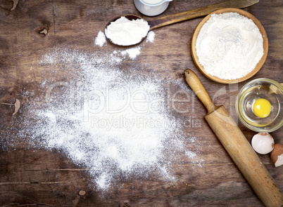 powdered flour on a brown wooden background