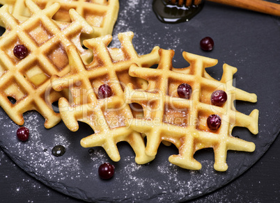 baked waffles on a black background