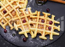 baked waffles on a black background