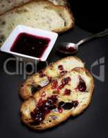 toasts of white bread and raspberry jam