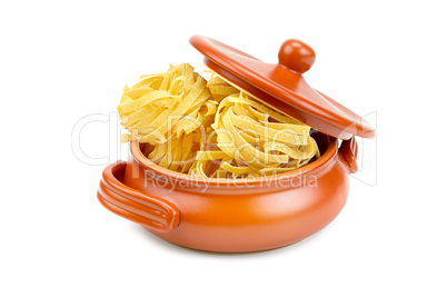 Pasta in a clay pot isolated on white background.