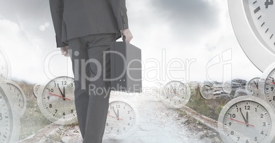 Businessman holding briefcase with surreal clocks time transition