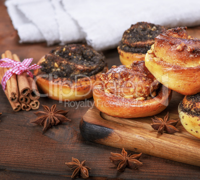 round baked buns with poppy seeds and with nuts
