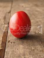 Colored Easter egg on wood