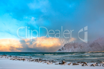 Winter Norway. Sea Surf and Colored Clouds