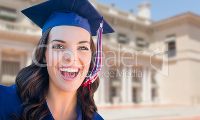 Happy Graduating Mixed Race Woman In Cap and Gown Celebrating on