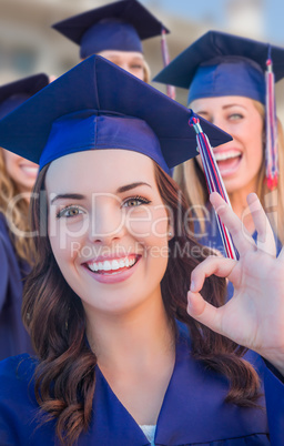 Happy Graduating Group of Girls In Cap and Gown Celebrating on C