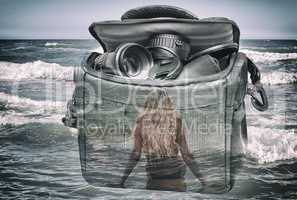The effect of double exposure: the camera, the girl and the sea.