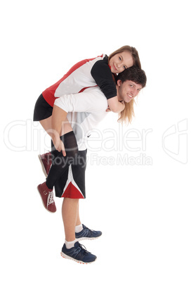 Young couple in exercise outfit do piggyback