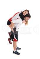 Young couple in exercise outfit do piggyback