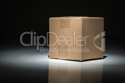 Blank Carboard Shipping Box Under Spot Light.