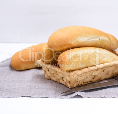 buns of white wheat in a wicker basket
