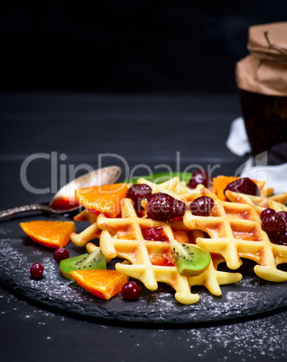 baked Belgian waffles with jam and fresh fruits