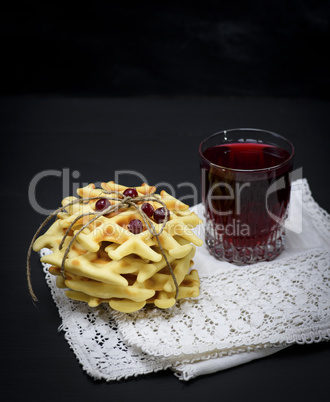 baked Belgian waffles and fruit compote in a glass