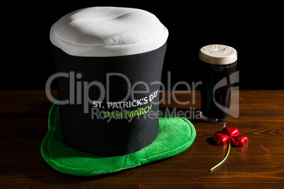 St Patrick day with a pint of black beer, hat and shamrock