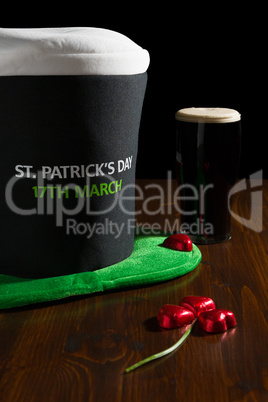 St Patrick day with a pint of black beer, hat and shamrock over