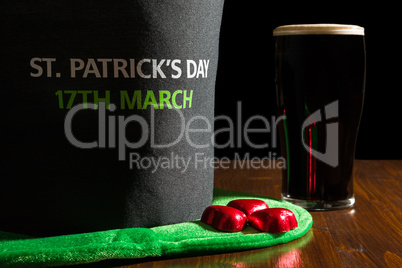 Closeup of St Patrick day with a pint of black beer and hat over