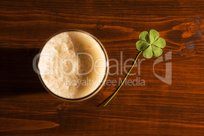 Pint of black beer and a shamrock