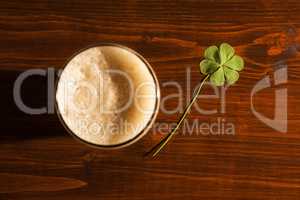 Pint of black beer and a shamrock