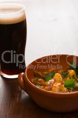 Traditional Irish Stew and a pint of beer in backlit