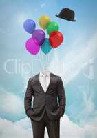 Headless man with surreal floating hat and balloons in front of sky