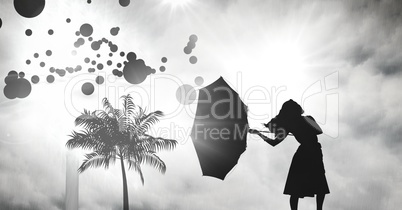 Women holding umbrella silhouette with tropical storm and circles