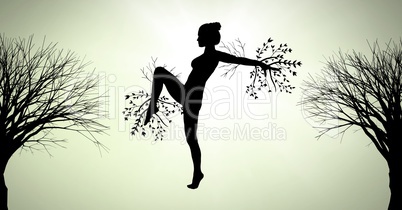 Woman surreal silhouette dancing with tree branches connected to nature
