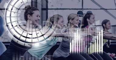 Athletic fit women in gym with health interface
