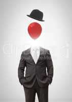 Headless man with surreal floating hat and balloon